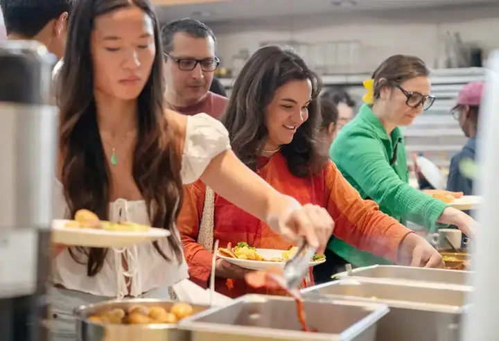 Volunteers preparing food hampers for community members